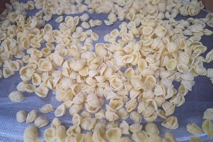 Orecchiette pasta drying in the sun