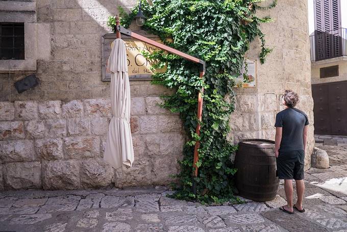 Colin reading about the oldest bakery in Altamura